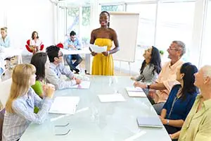 Volunteer teaching financial literacy