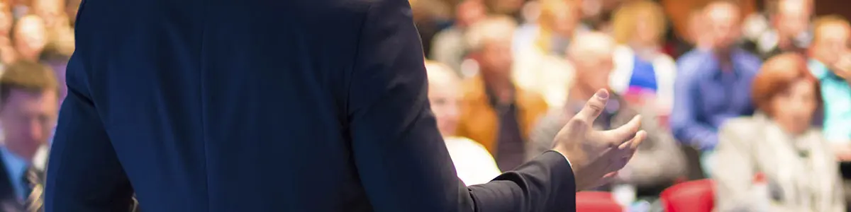 Speaker at Business Conference and Presentation. Personal Finance Speakers Association Member Delivering Keynote Address