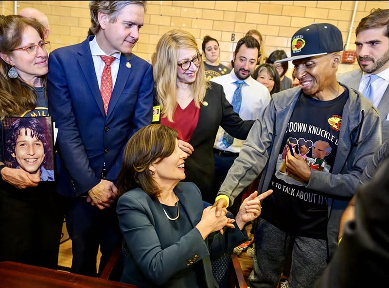 Charles Fisher6 800w spotlight Charles Fisher of the Hip Hop Summit Youth Council with Governor Hochul at the signing of Sammy’s Law