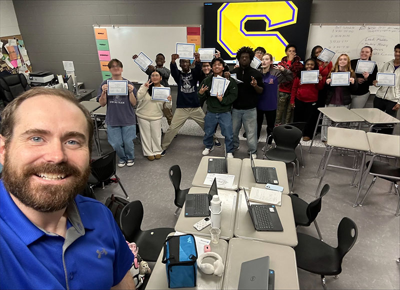Dr. Wally T Luckeydoo with students who passed the Working in Support of Education test.