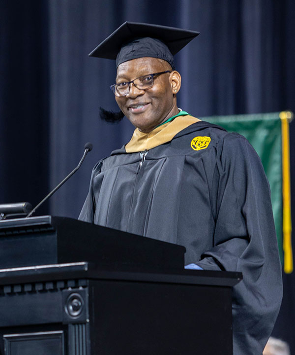 Ellis Cropper Graduate student speaker for Nichols College Commencement Ceremony 600w cropped Ellis Cropper, ChFC®, CLTC®, Retired U.S. Army Major speaking at the 2024 Nichols College Commencement Ceremony