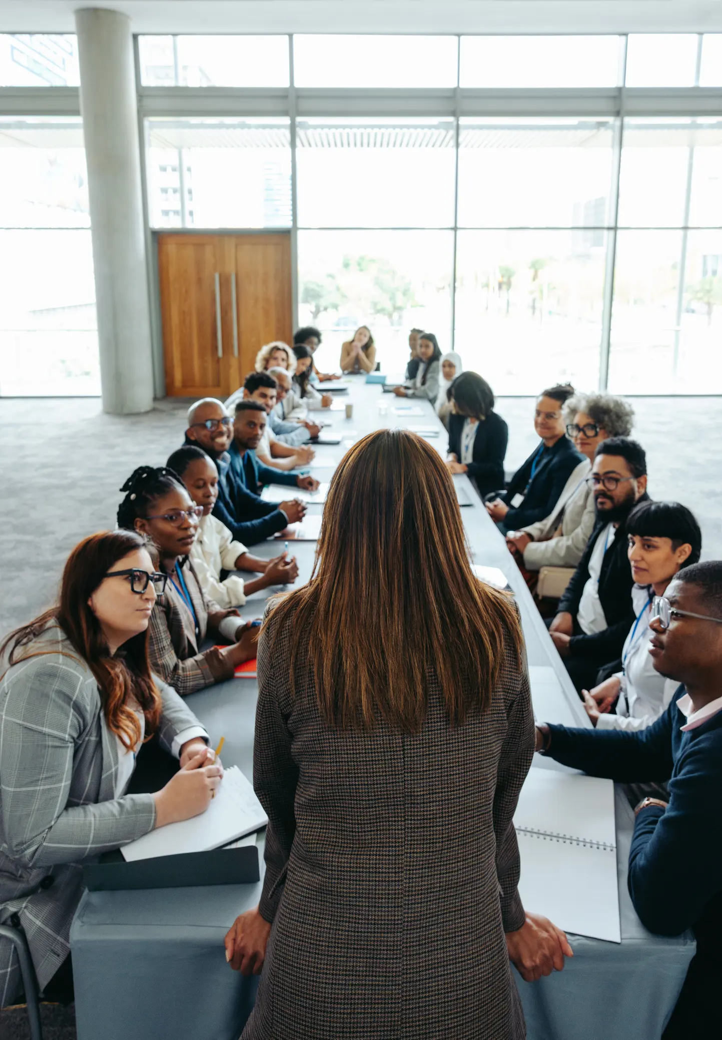 Empowered woman leading a diverse group meeting