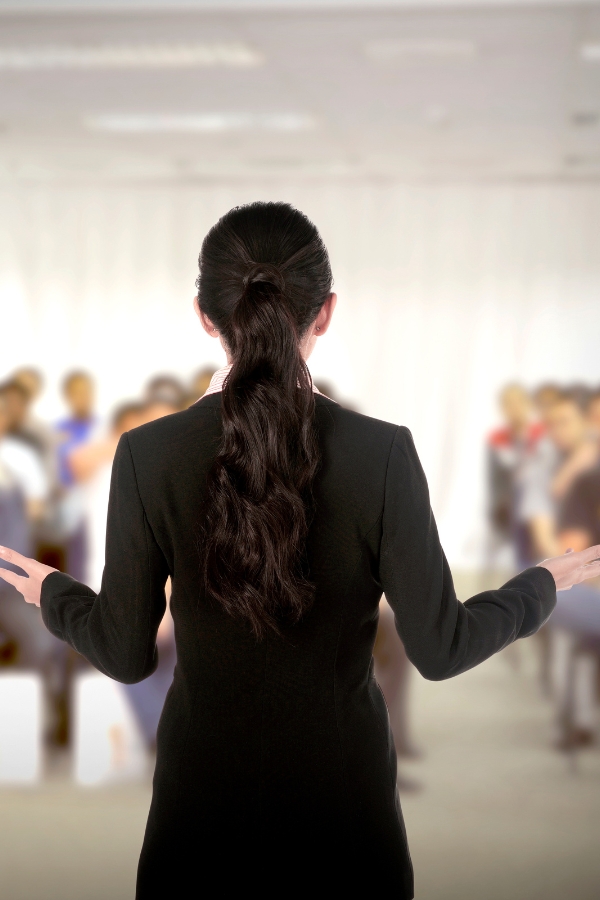 Speaker at conference and presentation. Audience at the conference hall 600×900