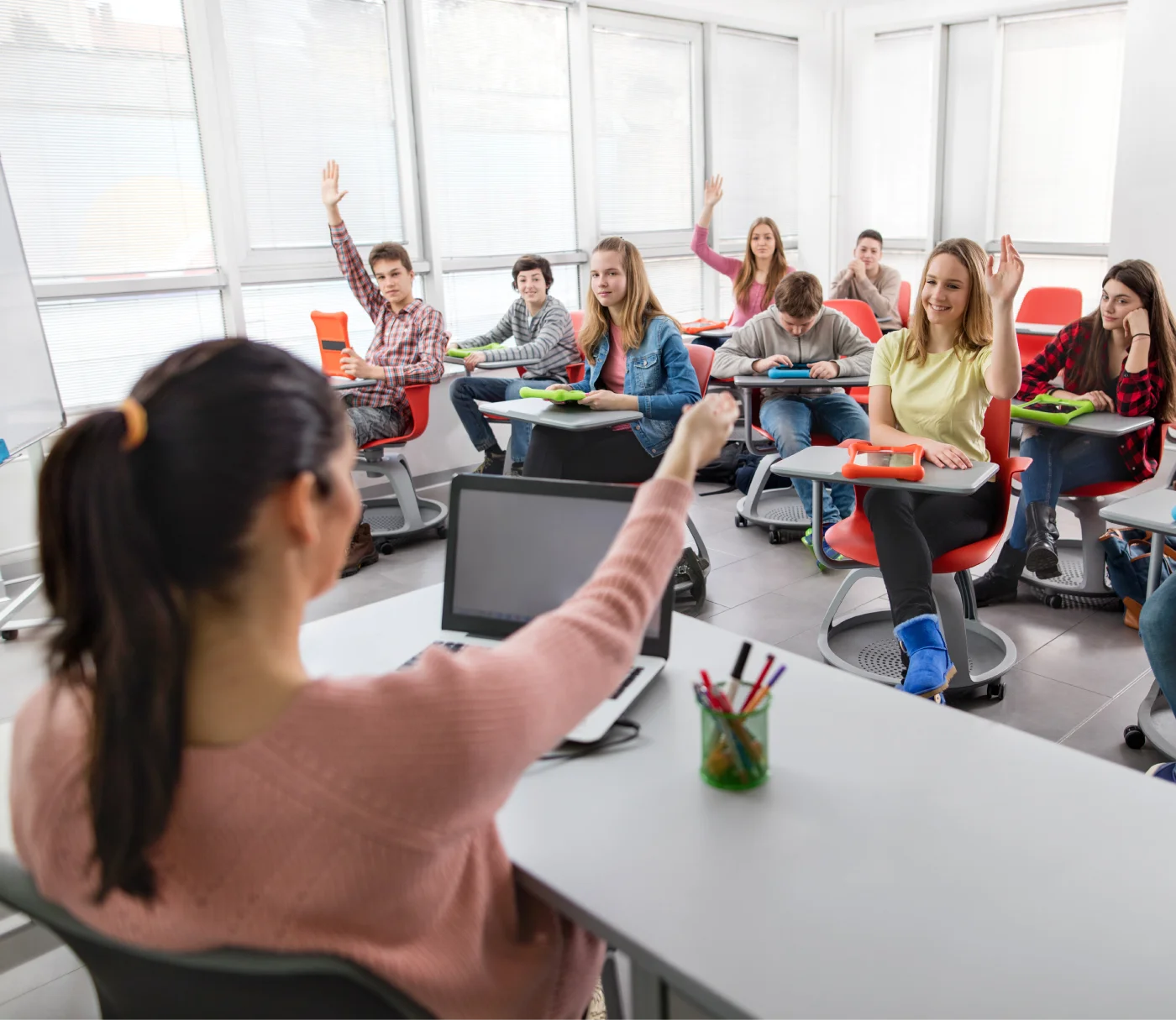 educator teaching high school students in a classroom