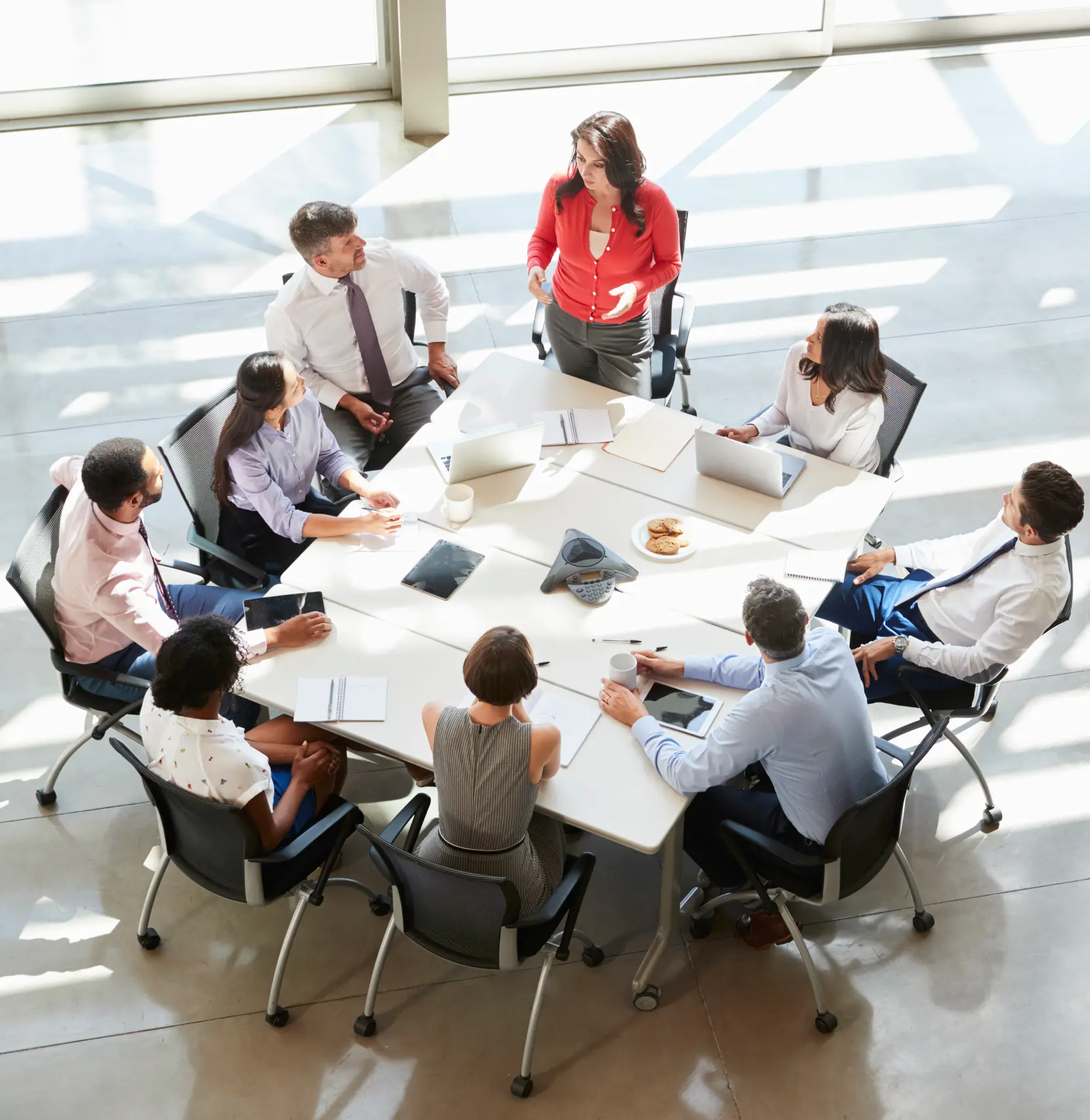 organizations and stakeholders working together in a meeting around a table